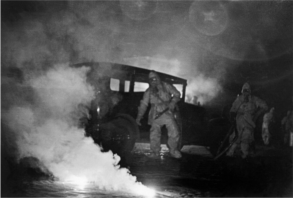 Robert Capa, [Man in a civil-defense drill, Paris], October 1936.